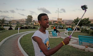 A man takes a selfie in Mogadishu’s new Peace Garden public park.