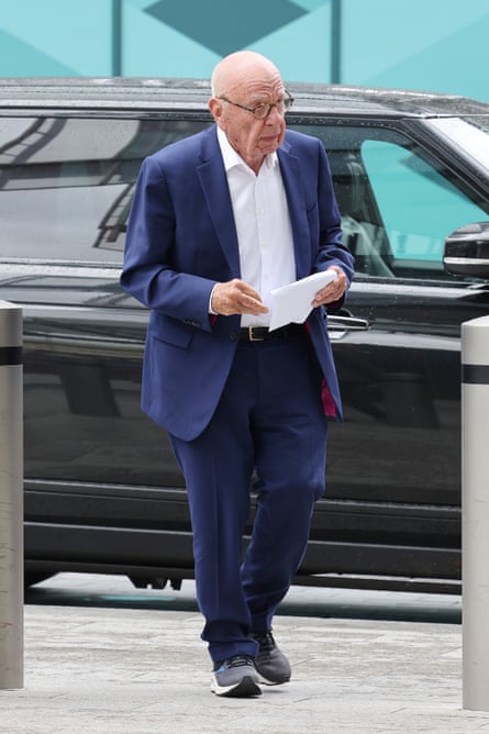 Rupert Murdoch stepping from a car