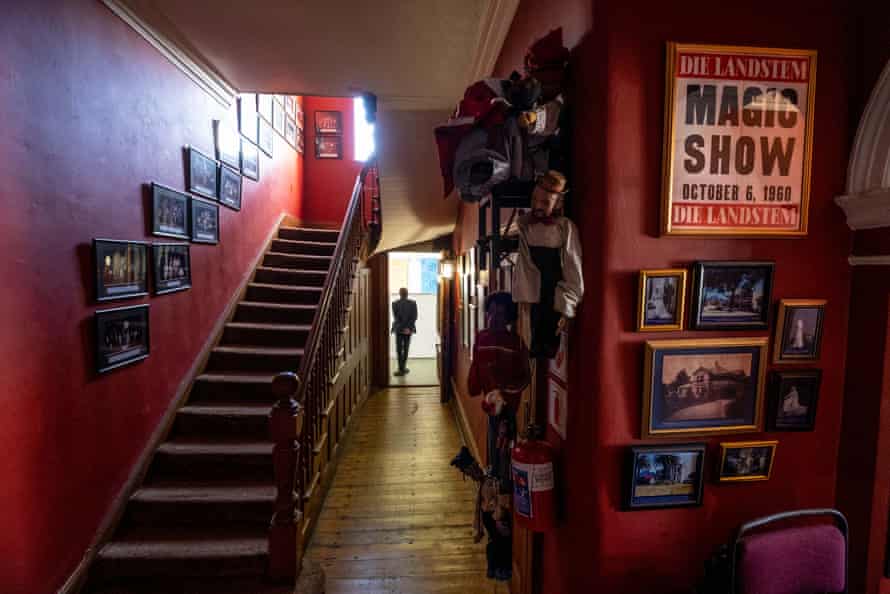 Puppets, photographs and posters on the walls of the college