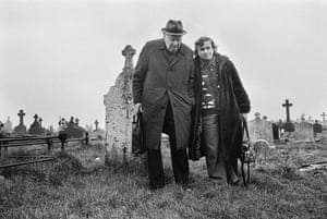 two people in a cemetery