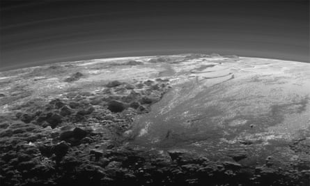 The atmosphere and surface features of Pluto, lit from behind by the sun.