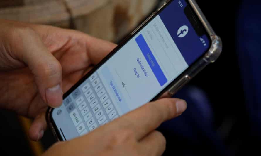 A person using Facebook at a cafe in Hanoi, Vietnam,
