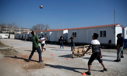 Migrants play soccer at the Eleonas refugee camp in Athens. Eleonas is filling up as thousands are prevented from continuing their journey north.
