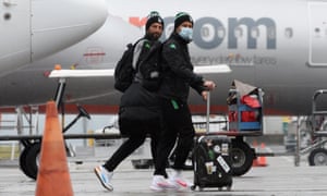 Western United A-League players and officials arrive on a chartered flight from Melbourne at Sydney Airport.