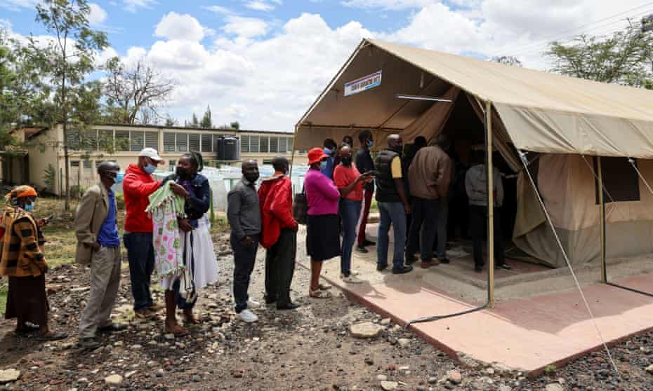 People queue to receive a Covid vaccine in Narok, Kenya.