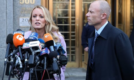 Stormy Daniels, accompanied by her then attorney, Michael Avenatti, right, talks to the media as she leaves federal court, on 16 April 2018 in New York. 