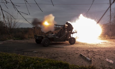 Ukrainian servicemen shoot towards Russian positions on the frontline near Kherson, southern Ukraine, Wednesday, Nov. 23, 2022.