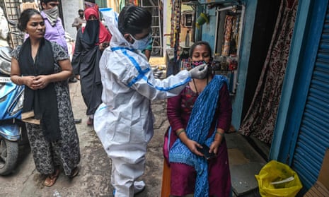 A health worker administers a Covid test in Mumbai