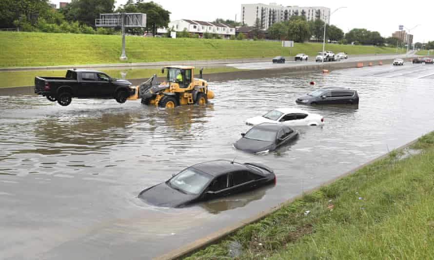 cars stranded on a flooded road