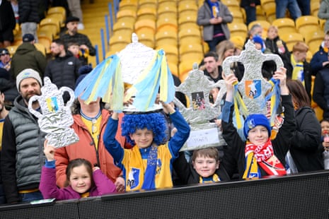 A few young Mansfield fans hold up tinfoil Cups.