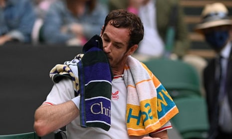 Andy Murray with one green and purple ‘championship’ towel and one turquoise and yellow ‘seasonal’ one on Monday. All players are now given one of each colour.