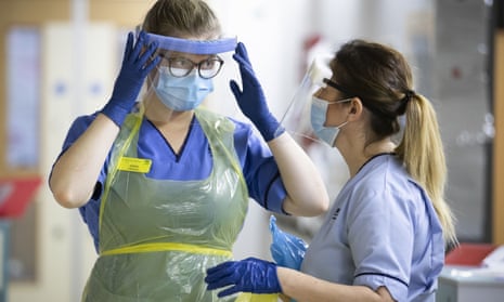 Nurses changing their PPE on a Covid ward at the Royal Alexandra Hospital in Paisley. 