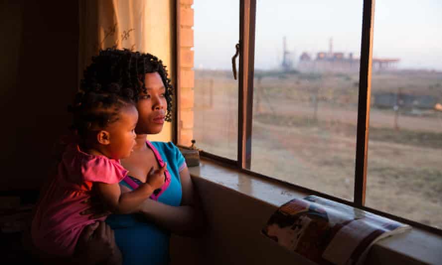 Eleriza Van Rooyen and her daughter Thandeka, aged nine months, can see Kusile power station from their new house. The family was relocated to make way for Kusile.