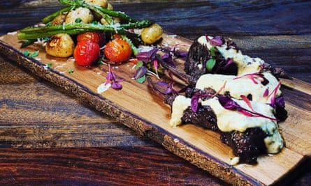 Lamb chops on a wooden slate at La Pazienza in Northampton
