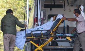 Coronavirus live news: London enters tier 3 restrictions; Trump will 'absolutely' encourage vaccine use | World news 3 Paramedics arrive with a Covid-19 patient at a hospital in Mexico City.
