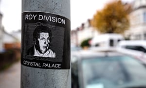 A sticker reading 'Roy Division' with a picture of Roy Hodgson, outside Selhurst Park