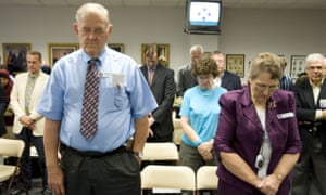 Anthony Bruner and Mary Lou Bruner pray at the start of a meeting of the Texas state board of education to discuss Islam and Christianity in textbooks in Austin, Texas on 24 September 2010.
