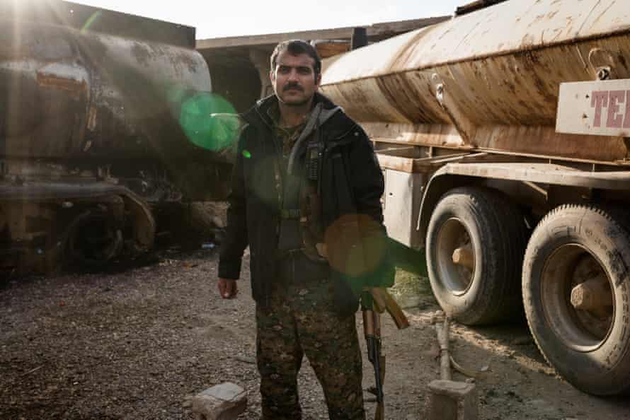 Aram Kochar, a fighter with the Syrian Democratic Forces (SDF) on the outskirts of Baghouz during a lull in fighting to retake it from Isis.