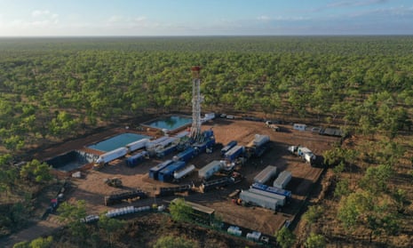 a remote industrial complex set against outback scrug