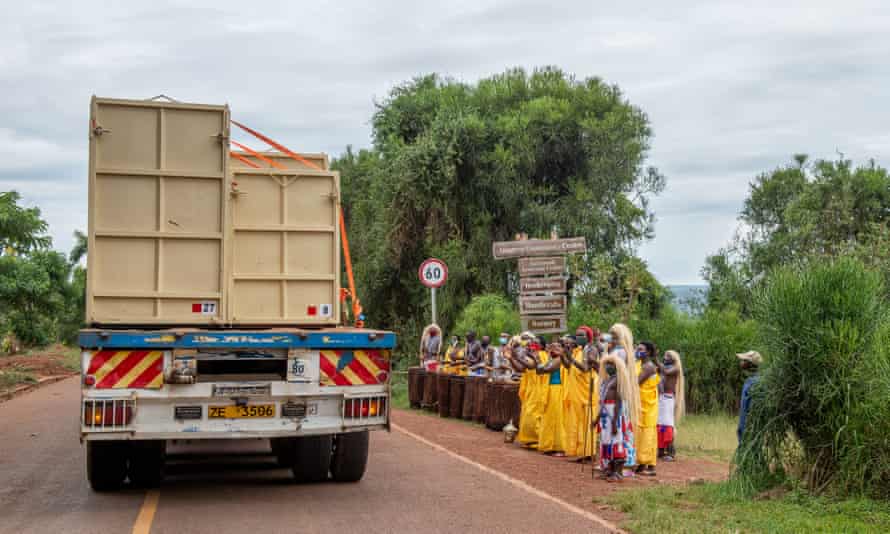People celebrate as the rhinos near their destination in Akagera national park.