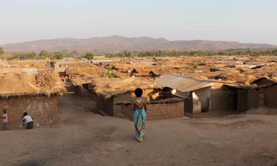 A woman looks over Dzaleka Refugee Camp, Malawi.