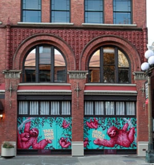 Sloths mural on Bon Voyage Vintage in Pioneer Square, by artists Casey Weldon, Alexander Shiloh Halladay, and Ego