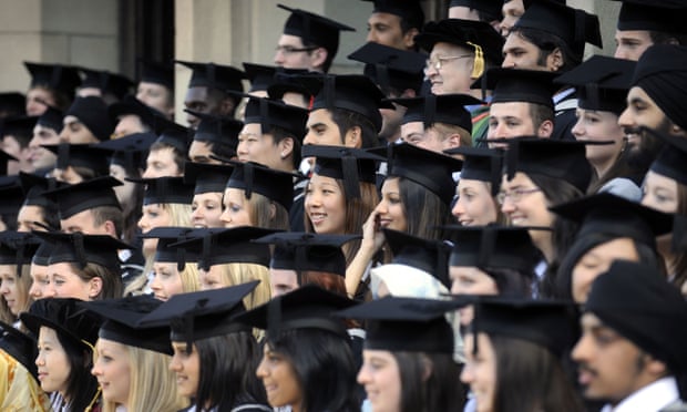 rows of university graduates in gowns and mortar boards