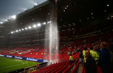 Rain pours down inside Old Trafford at full-time on Sunday.