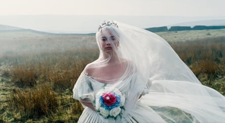 Margot Robbie as Catherine Earnshaw in bridal dress and veil in Wuthering Heights.