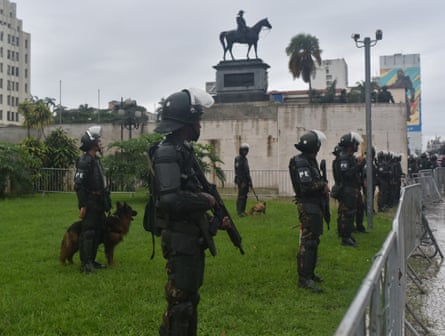 Brazilian army soldiers stand guard as they dismantle camps installed by supporters of former president Jair Messias Bolsonaro, outside the Eastern Military Command in Rio de Janeiro on 9 January 2023.