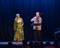 Anu Komsi sings onstage while Sakari Oramo plays violin beside her