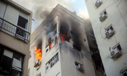 A Tel Aviv building ablaze after rocket attacks from the Gaza Strip.
