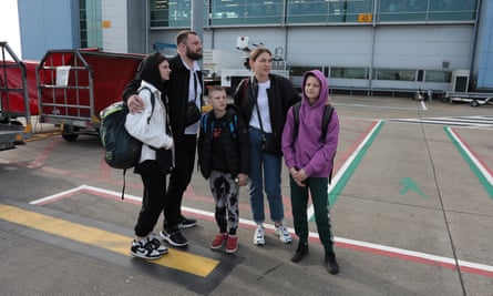 A family who fled Ukraine arrive at Luton airport