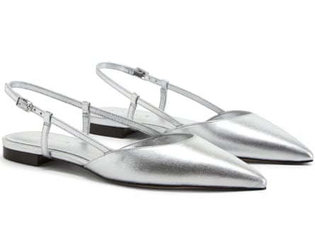 A pair of silver Everlane Studio Slingbacks with a small black heel