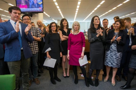 Beginning third from left, New York Times staff writers Jodi Kantor and Megan Twohey, senior enterprise editor Rebecca Corbett and reporter Cara Buckley celebrate with colleagues in the newsroom after winning the 2018 Pulitzer prize.