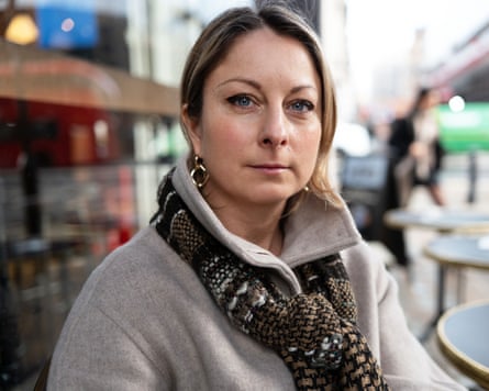 Claire Heafford, founder of Gymnasts for Change, sits outdoors with a serious expression