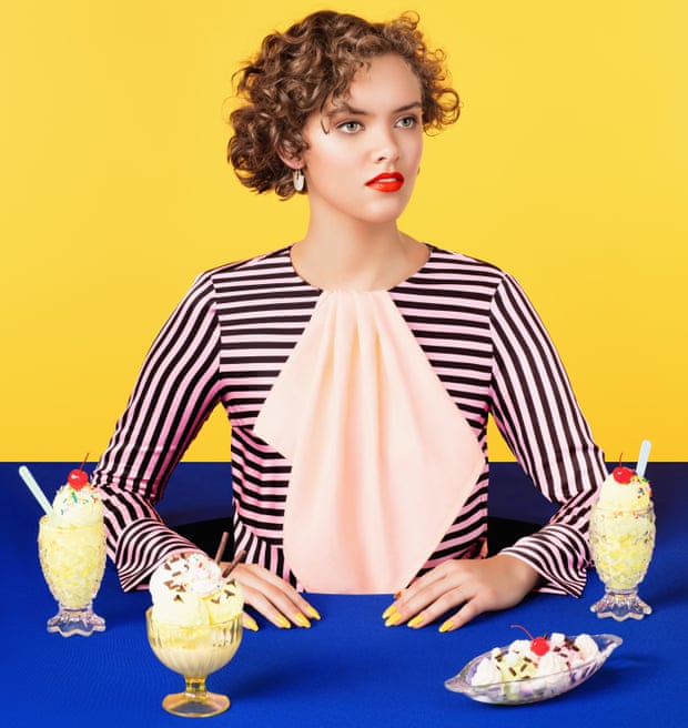 Cook and food writer Ruby Tandoh surrounded by puddings