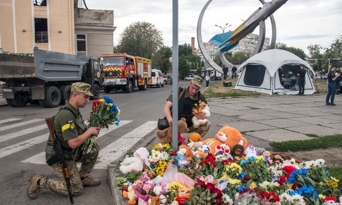 Ukrainian servicemen lay flowers and toys at a place where 4-years-old girl Liza was killed by a Russian cruise missile strike. Vinnytsia, Ukraine July 15, 2022