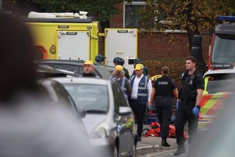 Police officers work at the scene following an incident outside a synagogue, in Manchester.