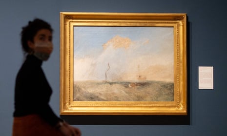 A gallery assistant poses by Turner’s sketch for The Fighting Temeraire.