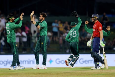 Pakistan's Shaheen Shah Afridi celebrates after taking the wicket of England's Jos Buttler (right).