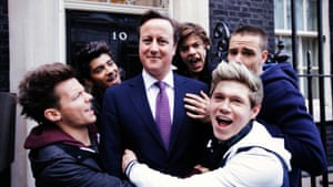 Prime minister David Cameron (centre) with (right to left) Louis Tomlinson, Zayn Malik, Harry Styles, Niall Horan and Liam Payne from One Direction at 10 Downing Street during the filming of the video for the official Comic Relief single, February 18, 2013.