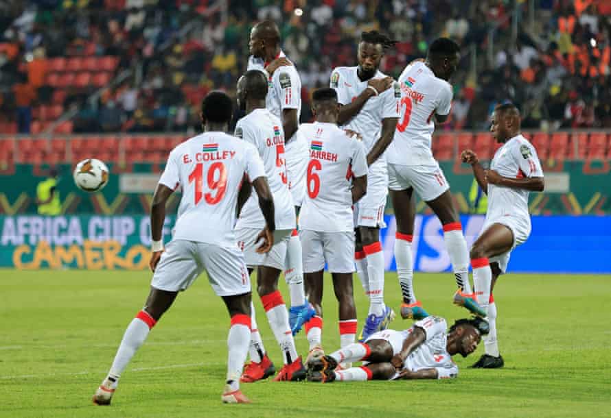 The Gambia wall defends a free-kick.