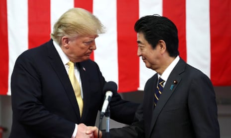 Donald Trump shakes hands with Japan’s prime minister Shinzō Abe.
