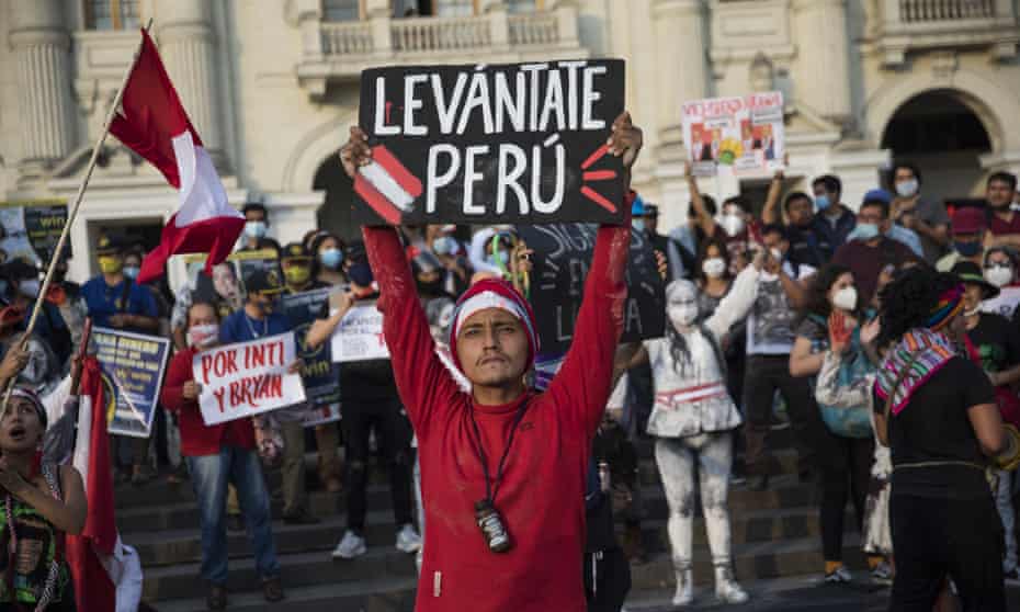 A performer holds a sign that reads in Spanish ‘Wake up Peru’ during a protest in Lima on Saturday. Nine out of 10 Peruvians opposed the ousting of Vizcarra, a recent poll found.
