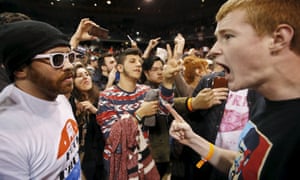 A Trump supporter shouts at a demonstrator inside the UIC Pavilion