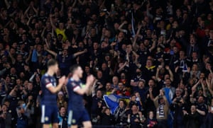 Scotland fans celebrate after the final whistle.