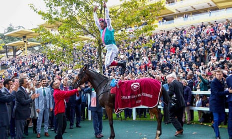 The traditional pic of Frankie Dettori completing his trademark leap off Enable.