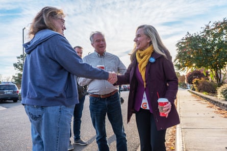 Abigail Spanberger and Sen. Tim Kaine of Virginia outside Woodbridge Middle School in Woodbridge, Virginia, on Election Day 2022.