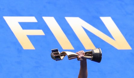 The Women’s World Cup trophy is held aloft beside the word ‘Fin’ after USA beat and Netherlands in the final at Stade de Lyon.
